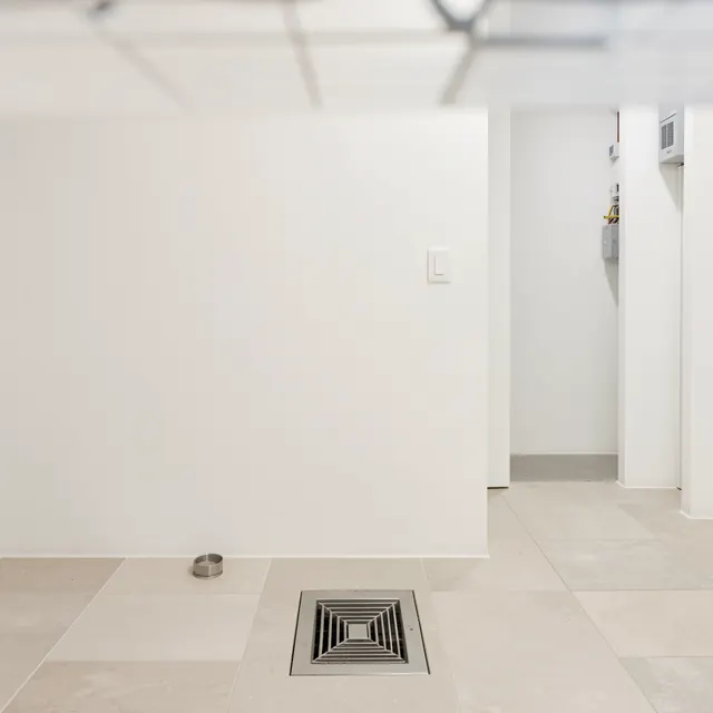Interior with floor vent and doorway